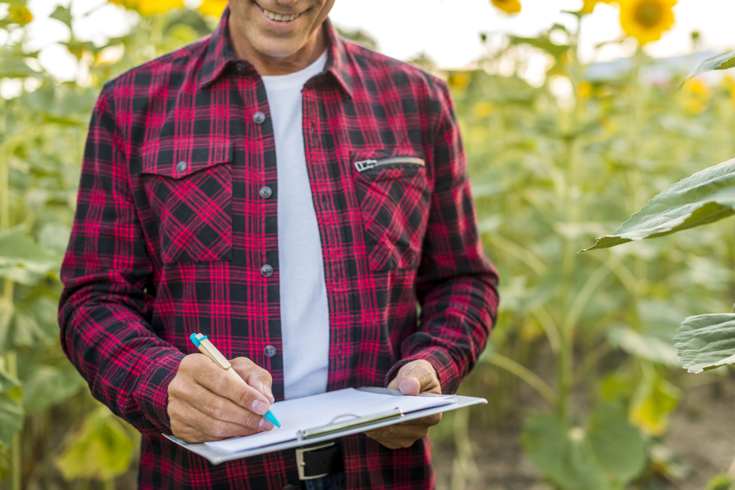 agronomist signing clipboard